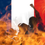 Protests France Paris. France flag. Protest in France. Rise hand. Pension reforms. Retirement age. Bastille day. Fireplace anarchy. Out of focus.