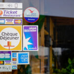 Bordeaux , Aquitaine  France - 05 01 2022 : ticket Restaurant brand cheque dejeuner logo and text sodexo sign front of restaurant windows door with card sticker amex CB visa
